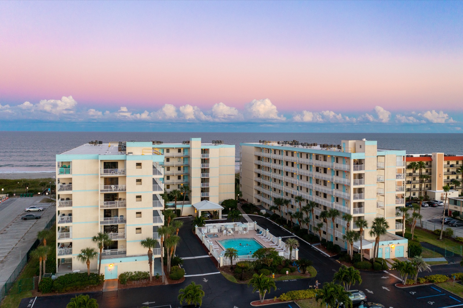 Sandcastles Condominiums — aerial view of building, pool, and ocean